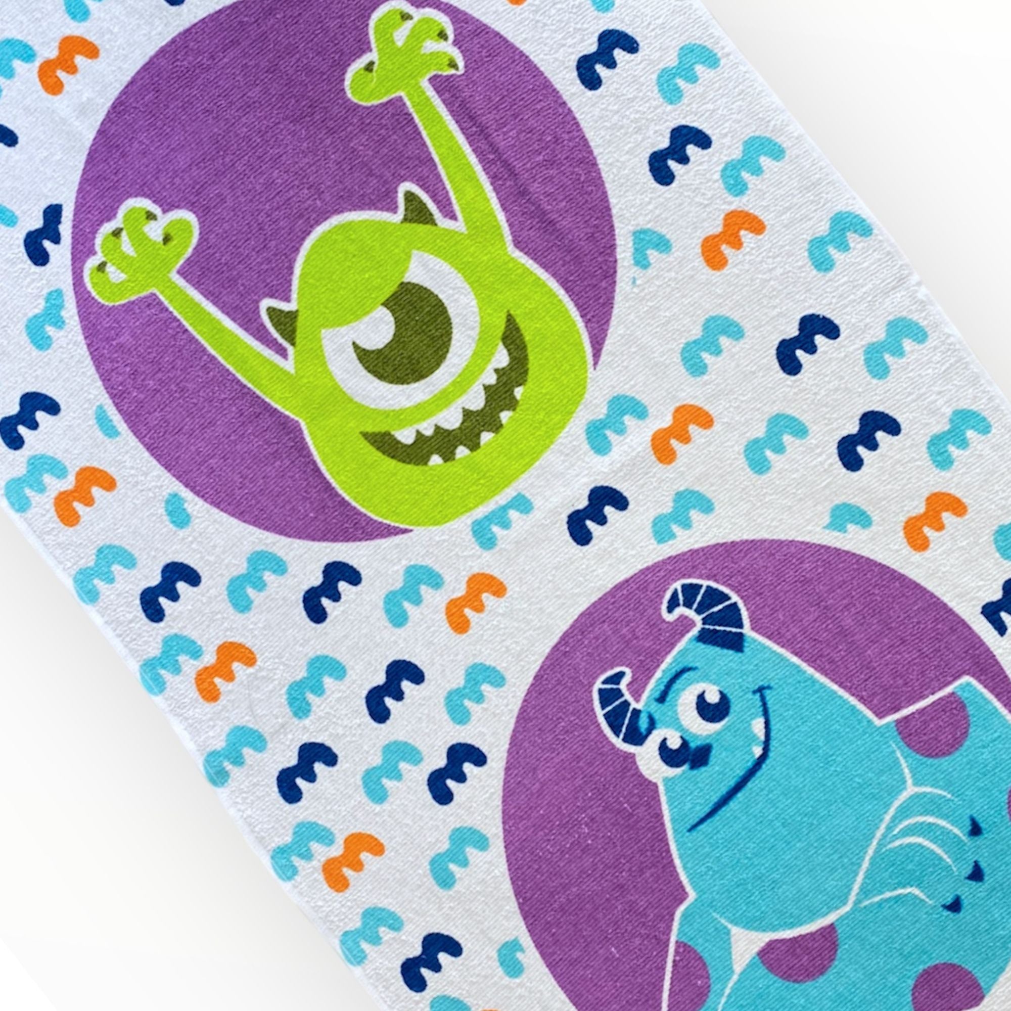 Toalla infantil Monster INC de 60 x 120 cm.