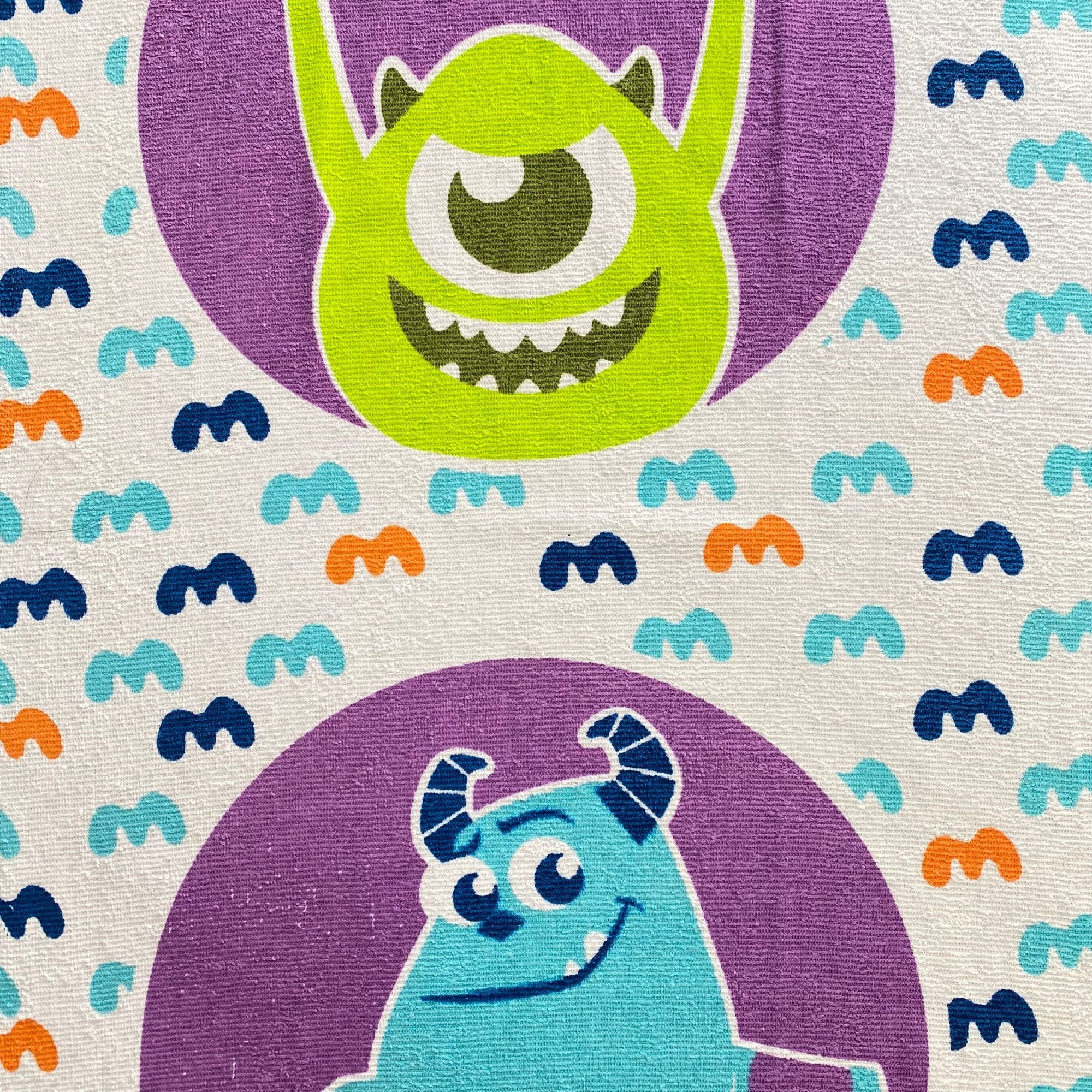 Toalla infantil Monster INC de 60 x 120 cm.